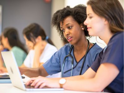 Medical residents at a computer (c) UC Regents. All rights reserved.
