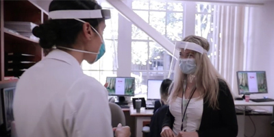 Dermatology residents in clinic (c) UC Regents. All rights reserved.