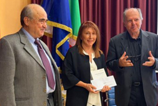 Flora Tassone receiving the 2025 Autism Without Borders Falanga Award