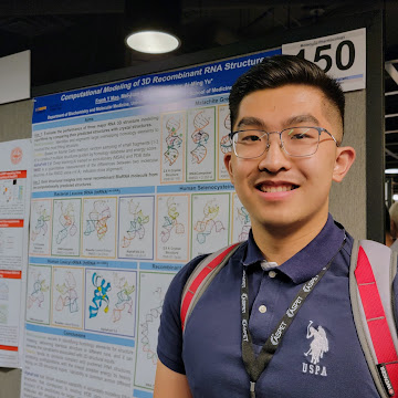frank mao first year t32 trainee in front of research poster