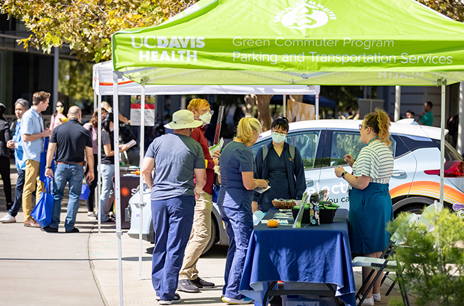 UC Davis Health green commuter booth at a sustainability fair