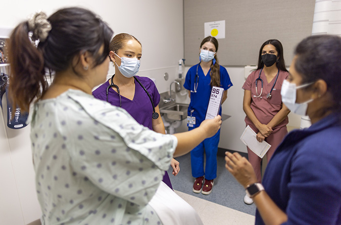 medical students with a patient
