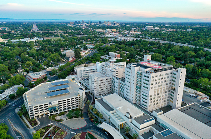Aerial view of UC Davis Medical Center, with Sacramento skyline beyond