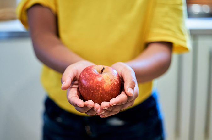 child with an apple