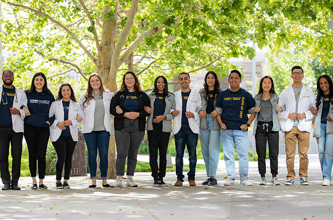 A group of medical students smiling for the camera 