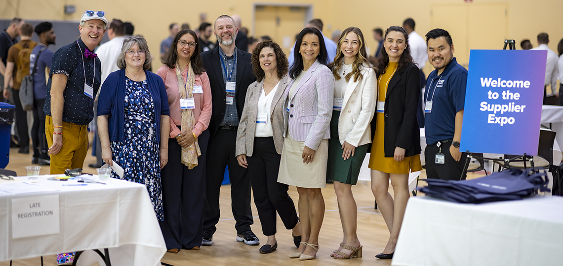 Supplier Expo attendees pose for a photo.