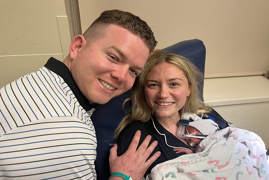 Baby Millie with her parents at the NICU