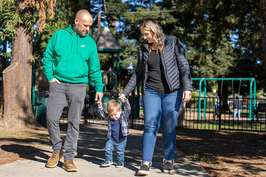 Patient Nixon with parents at the park