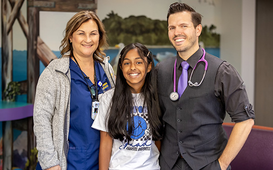 Pediatric diabetes patient with care team members