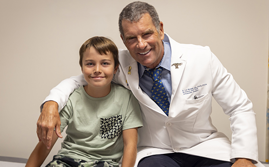 R. Lor Randall, chair of the Department of Orthopaedic Surgery, with pediatric orthopaedic patient