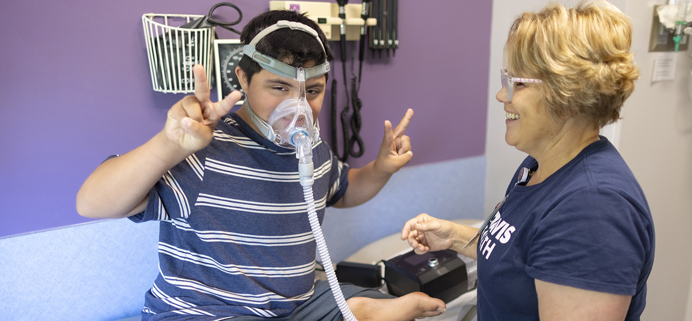 Pediatric pulmonology patient Emilio and his respiratory therapist