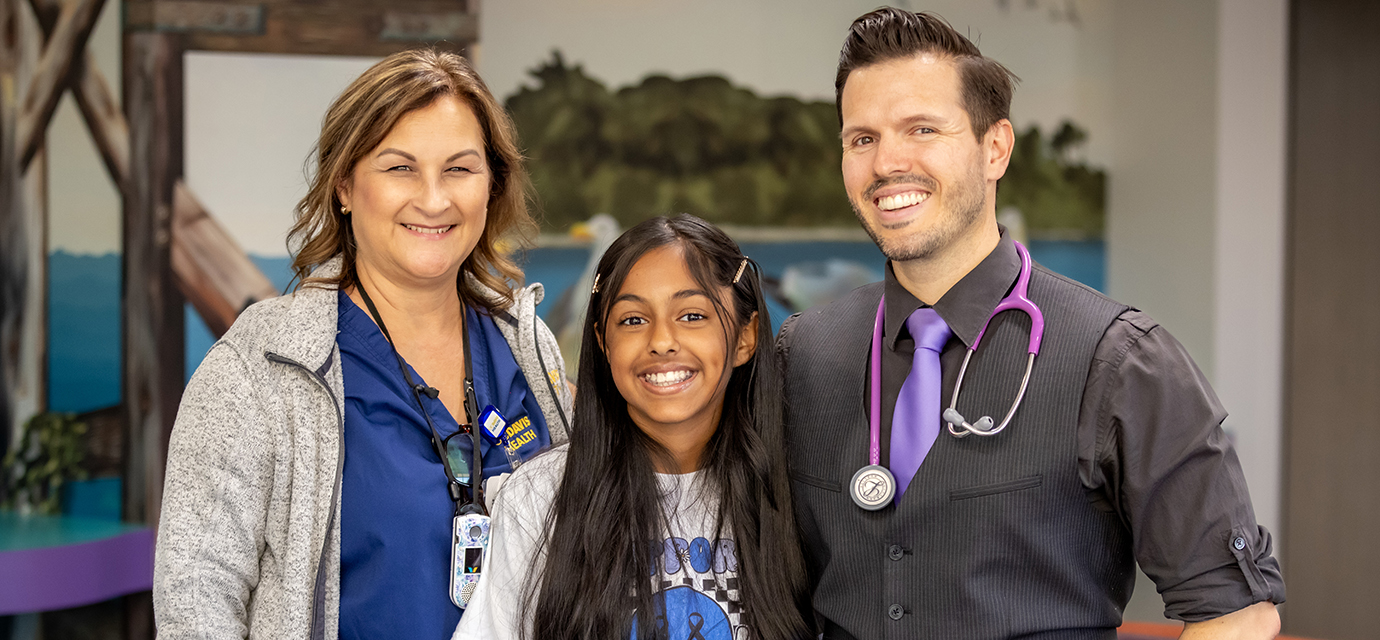 Pediatric diabetes patient Melina with care team members