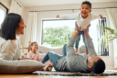 family of four playing