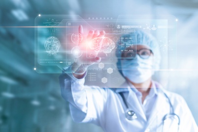 A doctor wearing a coat and mask touches a modern, transparent screen with health data.