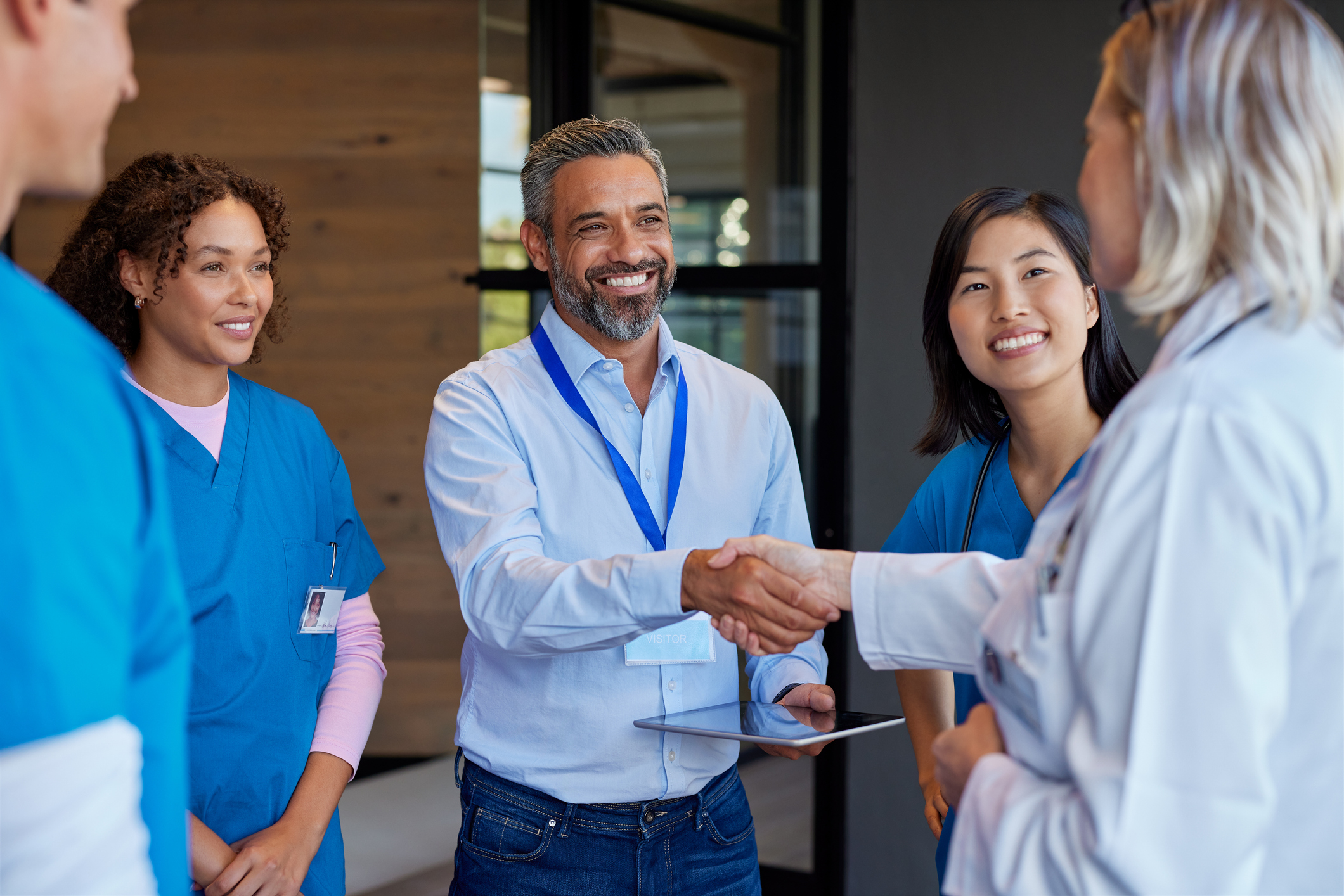 man greeting people