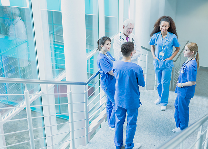 A promotional banner for Continuing Medical Education featuring a diverse group of medical professionals. 