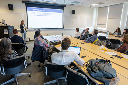 Healthcare workers at a seminar in a meeting room.