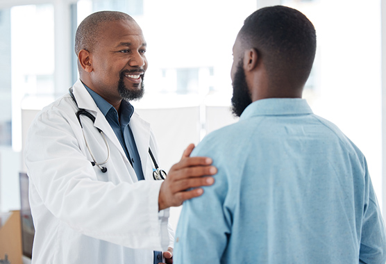 Urologist talking to male patient about low testosterone.