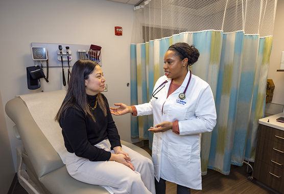Health care provider talking to patient about venous malformation.