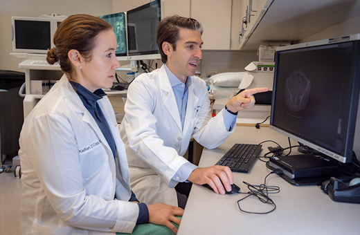 Urologists reviewing results from urodynamic testing.