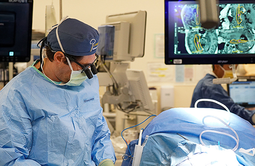 Surgeons performing brain tumor surgery.