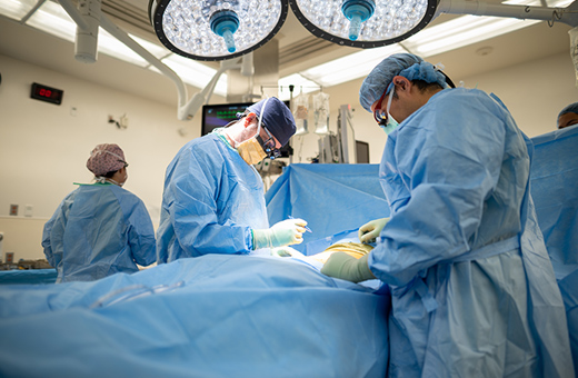 Surgeons performing esophagectomy on patient.