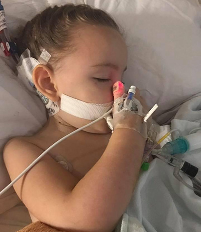 Young patient sleeping in hospital bed