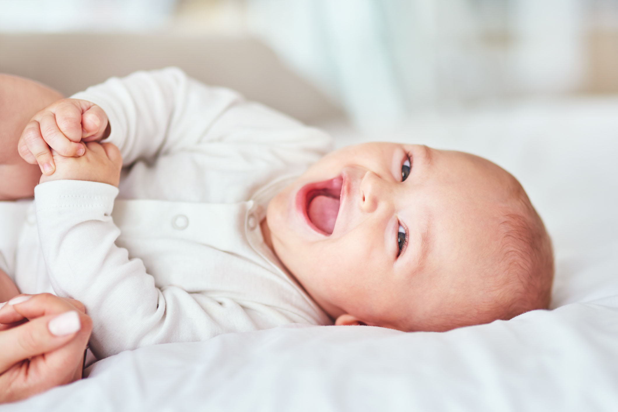 Baby smiling at camera