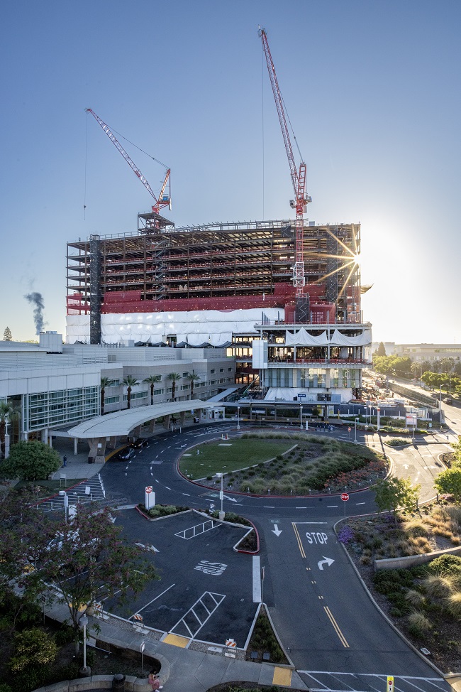 sun shines through California Tower construction