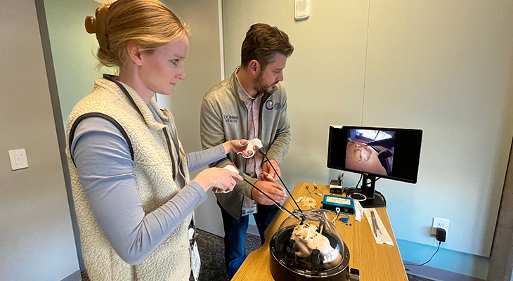 Elizabeth Reynolds and Christopher Pivetti demonstrate a model for training pediatric surgeons on fetoscopic repair.
