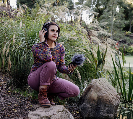 Liz Baxmeyer outdoors recording nature sounds