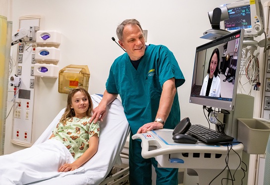 Youth patient meets with doctor via telehealth appointment