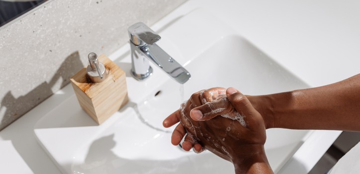 A person washing their hands with soap