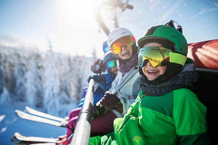 people on a ski lift with tips to avoid ski and snowboard injuries