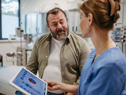 Man talking to female health care provider about GLP-1 drugs for weight loss