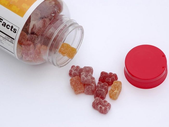 gummy vitamins spill out of bottle