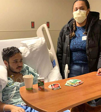 Joshuah and his mom in his hospital room days after his stroke