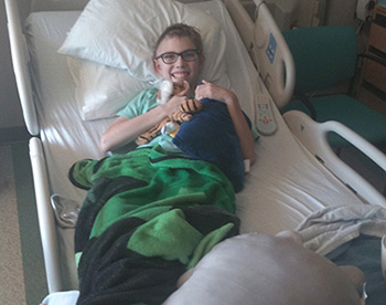 James recovering in the hospital after brain surgery