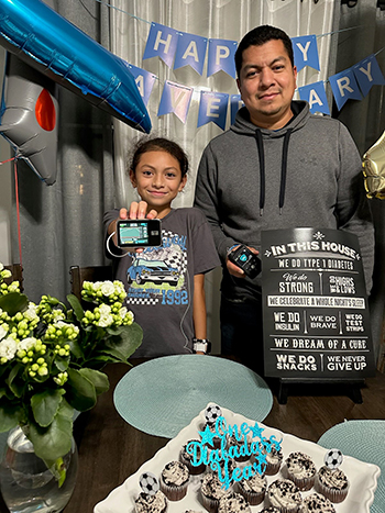 Elena and her dad celebrating the one year anniversary of her diabetes diagnosis