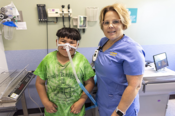 UC Davis respiratory therapist Audrey and patient Eduardo wearing his CPAP mask