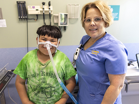 UC Davis respiratory therapist Audrey and patient Eduardo wearing his CPAP mask