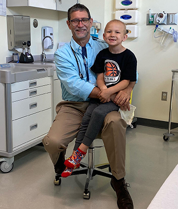 AJ and Marcio Malogolowkin, chief of pediatric hematology and oncology, during a follow-up visit
