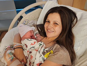 Kristin with her newborn in the hospital