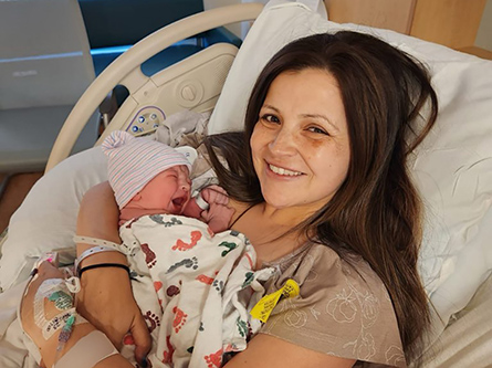 Kristin with her newborn in the hospital