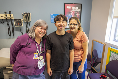 Justin and his mom at a recent visit with pediatric nephrologist Stephanie Tram-Anh Nguyen