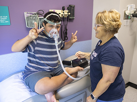 Pediatric pulmonology patient Emilio and respiratory therapist Audrey