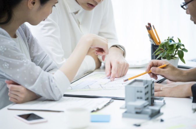 people reviewing blueprint