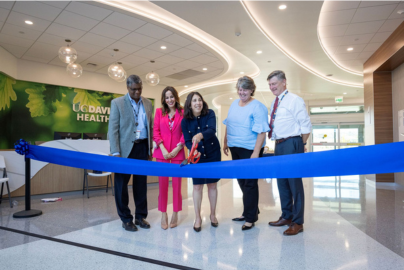 leaders cutting ribbon at folsom medical care clinic