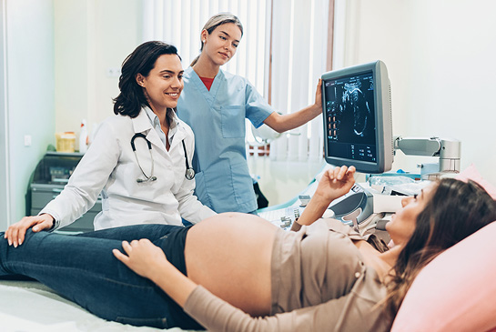 Pregnant woman in hospital bed