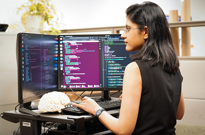 Neuroscientist Maitreyee Wairagkar looking at a computer.